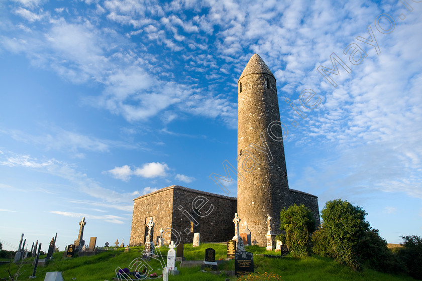 Round-Tower 
 Turlough Round Tower, Co Mayo, Ireland 
 Keywords: Irish, church, churches, religion, religious, buildings, christian, catholic, towers, sites, history, historic, heritage, morning, outdoors, scenery, scenes, graveyards, cemeteries, celtic, crosses, graves, headstones, churchyards