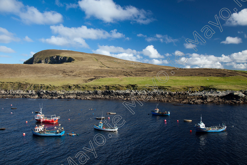 Boating-activity-along-the-North-Mayo-Coast 
 Fishing boats in Porturlin Harbour, Co Mayo, Ireland. 
 Keywords: Porturlin, County, Mayo, Ireland, atlantic, boats, coast, coastal, coastlines, fishing, harbours, hills, industry, Irish, landscapes, moored, moorings, mountains, ocean, outdoors, scenery, scenes, sea, trawlers