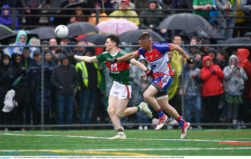 1696419 
 5 May 2019; Fergal Boland of Mayo in action against Matthew Queenan of New York during the Connacht GAA Football Senior Championship Quarter-Final match between New York and Mayo at Gaelic Park in New York, USA. Photo by Piaras Ó Mídheach/Sportsfile 
 Keywords: GAA, Football, ny, nyc, bronx, Manhattan, mayococo