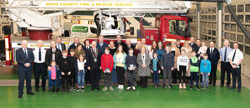 Photo-0020-captioned 
 Pictured in Castlebar Fire Station are the winners of the Fire Safety Awareness Competition for National School pupils with their families and friends, members of Mayo Fire Service, John Condon, Director of Services, Cllr Blackie, Cathaoirleach of Mayo County Council and Peter Hynes, Chief Executive of Mayo County Council. PHOTO: John Mee Photography