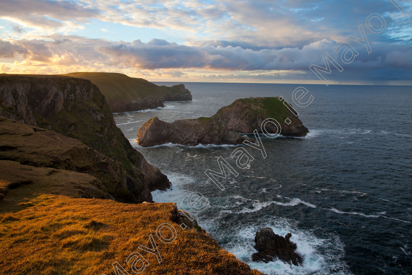 Coastal-Views-at-North-Mayo 
 Evening light on Kid Island, North Mayo seacliffs, County Mayo, Ireland. 
 Keywords: Kid, Island, North, Mayo, seacliffs, County, Mayo, Ireland, atlantic, clifflines, cliffs, coastal, coastlines, coasts, headlands, Irish, islands, ocean, outdoors, remote, scenery, scenes, seacliffs, sea, shorelines, shores, wild, rocky, rock, evening, dusk, sunset, sun, set