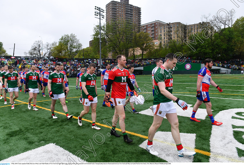 1696510 
 5 May 2019; Team captains Paddy Durcan of Mayo and Niall Madine of New York lead their sides in the parade before the Connacht GAA Football Senior Championship Quarter-Final match between New York and Mayo at Gaelic Park in New York, USA. Photo by Piaras Ó Mídheach/Sportsfile 
 Keywords: GAA, Football, ny, nyc, bronx, Manhattan, mayococo