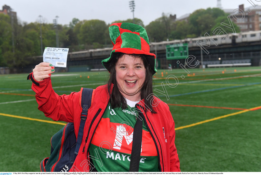 1696069 
 5 May 2019; First Mayo supporter into the ground Annette Garvey, from Crossboyne, Claremorris, with her ticket at 8.15am for the 2.15pm throw-in of the Connacht GAA Football Senior Championship Quarter-Final match between New York and Mayo at Gaelic Park in New York, USA. Photo by Piaras Ó Mídheach/Sportsfile 
 Keywords: GAA, Football, ny, nyc, bronx, Manhattan, mayococo